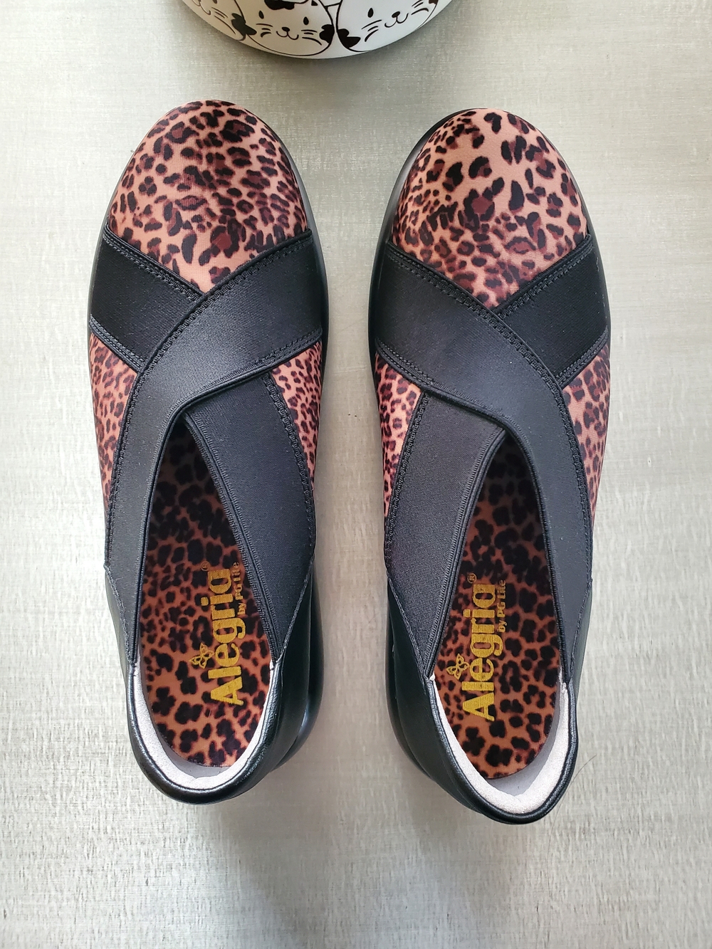 Like New Alegria Leopard Print Slip-On Flats with Black Cross Straps